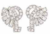 Warburg ollection $6,000-8,000 90 Platinum and Diamond Double lip-brooch, Oscar Heyman & Brothers, Retailed by Gumbiner The stylized paisley-shaped clips centering 2 emerald-cut diamonds