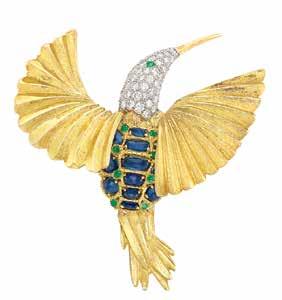 3 1 5 2 1 Gold, Platinum, Diamond, abochon Sapphire and Emerald Bird Brooch The stylized hummingbird with fanned textured gold wings, its platinum head encrusted with round diamonds approximately 2.