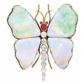 305 308 306 307 305 Antique Gold, Platinum, Boulder Opal, Ruby and Diamond Butterfly Brooch With wings of 4 large freeform boulder opal plaques, centering one gold collet-set oval ruby head flanked