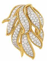 345 346 347 349 348 345 Gold, Platinum and Diamond lip-brooch, David Webb 18 kt., composed of overlapping flared platinum leaves pavé-set with 135 round diamonds approximately 8.95 cts.