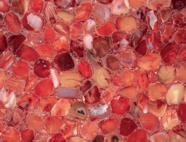 Carnelian A glassy translucent stone, is an orange colored variety of chalcedony a quartz family, it is also a brownish-red mineral commonly used as semi precious gem stone.