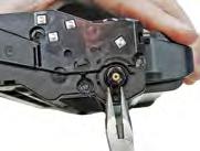 Using the screwdriver, remove the screws on both side panels of the cartridge (see example A).