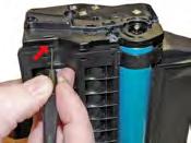 Once the screws and the axle have been removed, use the small flat head screwdriver to release the tabs that lock