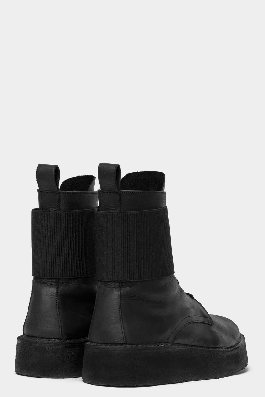 OA 06-1 Solid Boot High top boot in genuine treated black leather with solid heavy para sole. Height of sole is 4 cm at heel point.