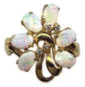 #12762 #12759 18Kt. Yellow Gold Lady s Ring with 11x14mm oval Australian Opal of 2.32 Cts. & six round Diamonds of.12 Cts. TW. Size 7 3/4. $1,250.00 #12765 18Kt.