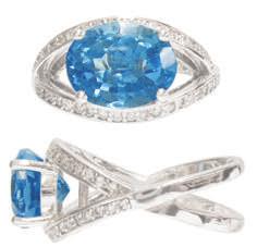 White Gold Lady's Ring with checkerboard faceted 9x14mm oval Swiss Blue Topaz & round Diamonds of.27 cts. TW. Size 7. $1,400.00 #16585 Lady's 14Kt.