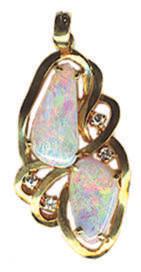 08 Cts. TW. $875.00 #OC-FP-8386 Pendant with one each approximately 5x8mm, 6x10mm & 8x8x9mm freeform Australian Opals of 1.