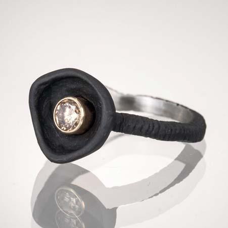 Artist: Sarah Graham Name: Confluence Ring with Cognac Diamond in Blackened Chrome & 18kt Yellow Gold Item # 6522 ALU: 10R1 3 3S Finger Size 6.5 1 Diamond at 0.