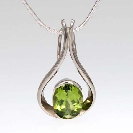 Artist: Tom Kruskal Name: Raindrop Peridot Pendant in 14kt White Gold Item # 3545 ALU: D092GUW Peridot Description: 14kt White Gold Hand Forged One Oval Faceted Peridot 9mm X 7mm Partial