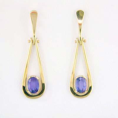 Artist: Tom Kruskal Name: Teardrop Tanzanite Earrings in 14kt Yellow Gold Item # 1888 ALU: ZME159GZ Tanzanite Description: 14kt Yellow Gold hand forged two 6mm x 4mm oval faceted Tanzanites