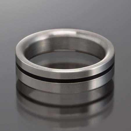 4mm wide by 2mm thick Regular Price: $1,308 Sale Price: $654 Artist: XEN Name: Stainless Steel Band with Offset Black Inlay Item # 4405 ALU: 011156G Description: Stainless Steel 6mm band with single