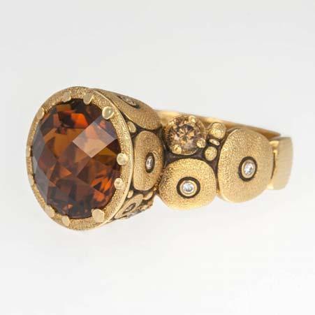 96cts custom cut cognac zircon The high profile gemstone setting and band have round hammered shapes There are twenty round white diamonds at 0.
