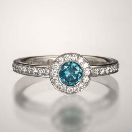 Name: Cindy Engagement Ring with Blue & White Diamonds Item # 2525 ALU: RB205DC.20 1*.27 42P 44 Diamonds at 0.94cttw Description: Platinum One Round Color Treated Blue Diamond at 0.