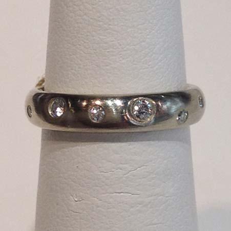 Name: Starlight Band with 12 White Diamonds 4mm Wide in 18kt White Gold Item # 10306 ALU: ZM R314D4M.25/12W Finger Size 5.5 12 Diamonds at 0.