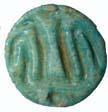 Stamp seal possibly inscribed with a stick figure of a man. Faience.