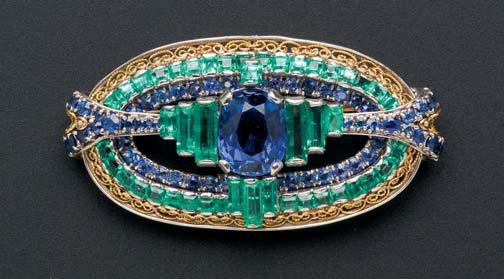 712 702A. Art Deco Sapphire and Diamond Bow Brooch, T.B. Starr Inc., centering a line of calibré-cut sapphires, framed by 118 full-cut diamonds, lg. 3 3/8 in., signed. $3,000-5,000 703.