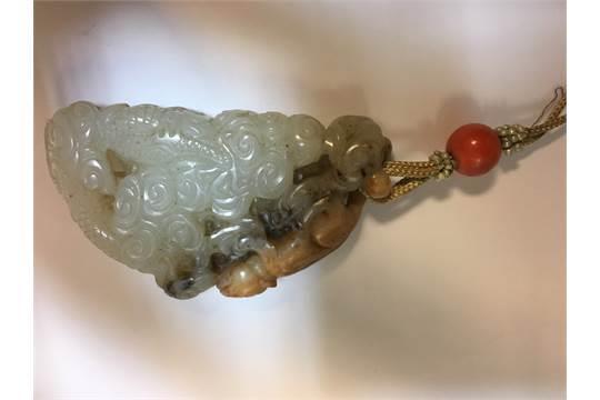 746 Chinese carved jade pendant carved with a big cat fighting a coiled dragon