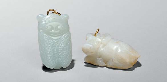 122 121 123 124 119 White Jade Archer s Ring, China, tubular with the top side angled to form a fat rim, the stone of pale celadon with white translucent inclusions and brown spots around bottom, ht.