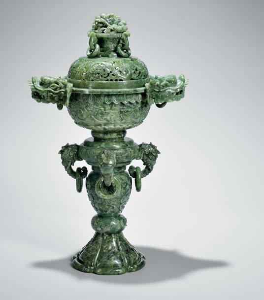 158 156 Nephrite Jade Miniature Gu Vase, China, three tiers, each with eight flanges along the four edges and sides, decorated with taotie masks on the handle, pale celadon stone with russet markings