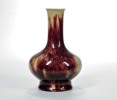 207 211 Flambé-glazed Bottle Vase, China, 19th/20th century, compressed globular form with cylindrical neck and slightly flared mouth, resting on a waisted stem foot, unglazed base and foot ring, the