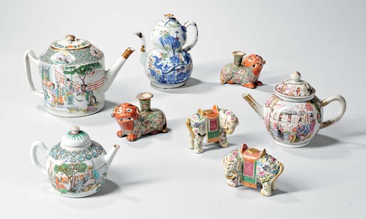 301 304 302 300 Pair of Famille Rose Porcelain Jars with Wood Covers, China, 18th/19th century, bulbous with a short bisque neck and foot ring, each decorated in polychrome enamels with two sets of