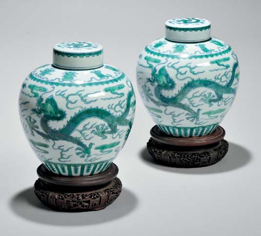 313 313 Pair of Blue and Green Dragon Jars, China, 19th century, ovoid, the sides decorated with two dragons and pearls amidst clouds, a band of the Eight Buddhist Emblems at the shoulders and a