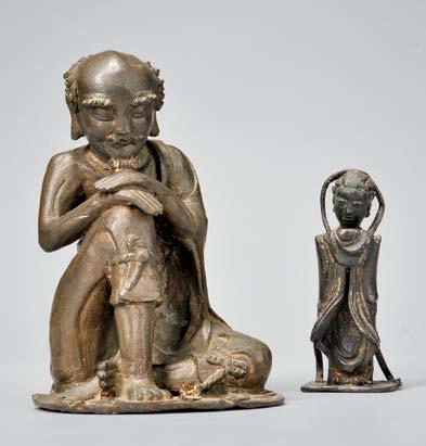 419 426 Gilt-bronze Figure of Tara, Tibetan China, 16th century style, seated on an oval stand, in a loosely cross-legged position with her left elbow lightly touching her left leg, her crowned head