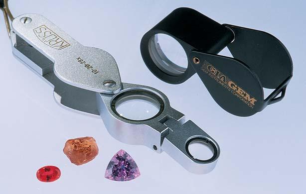 The loupe is a gemologist s most useful and portable tool. Shown here are a GIA Gem Instruments 20.5 mm, 10 triplet corrected loupe and a 10-20-28 corrected loupe from A.