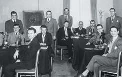 Figure 2. Standing in the back of a February 1949 gemology class at GIA s New York office are G. Robert Crowningshield (in front of the chalkboard) and Richard T. Liddicoat (back row, far right).