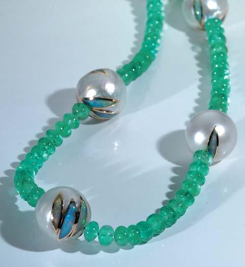 Figure 16. The Magic Pearls in this necklace are accompanied by emerald beads. The Australian South Sea cultured pearls (15.0 17.5 mm) have been inlaid with opal and 18K gold.