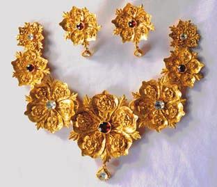 set depicting swaying flowers; a rose bracelet with openwork and a