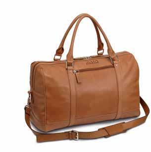 2 1 3 1 WEEKEND BAG, AMG Vintage-look cognac-coloured calfskin. Dark brown 100% cotton lining. Sturdy handles. Zipped compartments inside and out. Detachable leather shoulder strap with snap hooks.