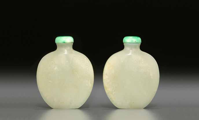 6097 (two views) 6097 A FINELY INSCRIBED WHITE JADE Possibly Imperial, 1750-1820 Well-hollowed, the spade-form bottle with a waisted neck, flat lip and finely recessed foot, one side lightly incised