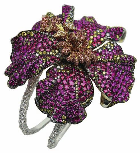 The hibiscus cuff mimics life by interpreting the flower perfectly by using 2,300 rubies and pink, yellow and white diamonds.