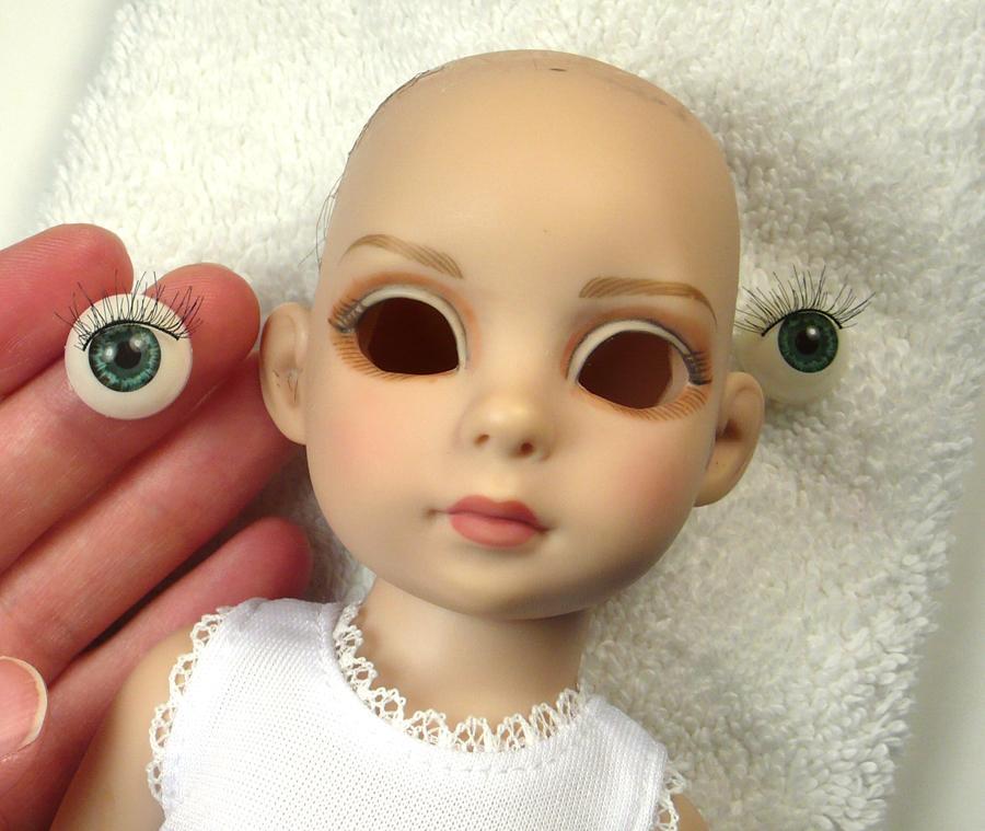 The plastic eyes Patsy comes with have clear silvery rings around the outer edge, so you are just seeing the edges of the eye.