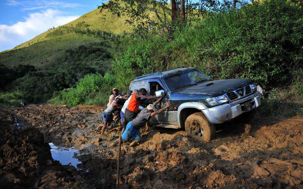 Ruby and sapphire rush near Didy, Madagascar 26 Figure 25: Local villagers helping our car pass through to the other side of a mud trap
