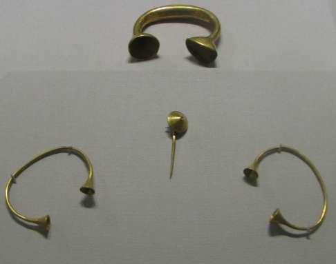 Three Bracelets and a sun flower pin Item: Three Bracelets and a sun flower pin Date: 800-700 BC Find Location: Drissoge, Athboy.