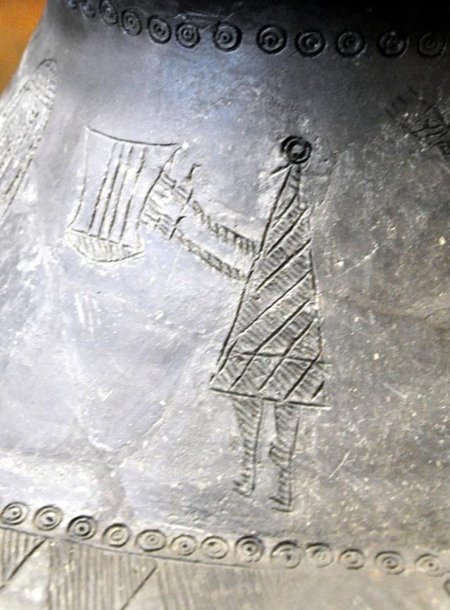 Image: Person playing a lyre, drawn on neck of