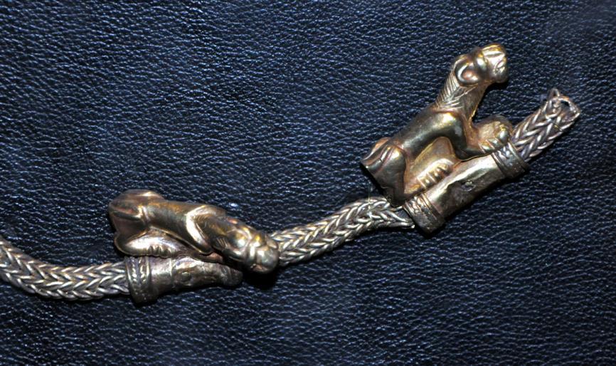 Image: Scythian metalwork lion ornaments on end of