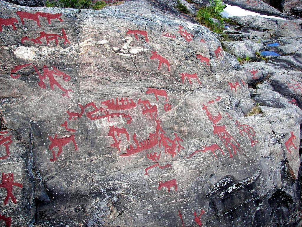 Image: Elk and boats (Northern hunter-gatherer tradition art). Petryglyphs; red paint is modern.