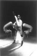 um (2003) was a solo-performance, with the choreographer on stage, created in co-production with the Reggio-Parma Festival, which hosted its debut in 2003.