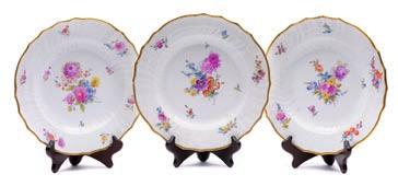A Coalport porcelain dessert service comprising two oval, two square and two shell shaped dishes, six plates and a stand each enamelled with rose centred bouquets within a green