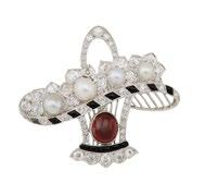 7 grams $7,000 9,000 39 FRENCH PLATINUM FILIGREE BROOCH formed as a flower basket and set with an oval garnet cabochon, 4 pearls, 54 various old cut