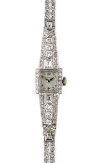 50 LADY S MILNER WRISTWATCH circa 1969; 17 jewel movement; rectangular lapis dial; in an English 18k white gold case set with 16 brilliant cut diamonds