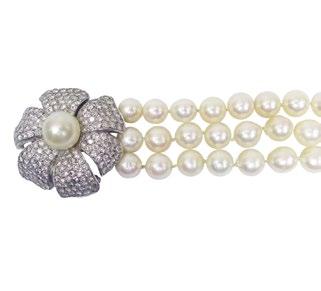 a South Sea pearl (13.2mm), 14.9 grams $1,800 2,400 125 TRIPLE STRAND CULTURED PEARL NECKLACE (9.