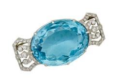 133 PLATINUM FILIGREE BROOCH set with a large oval cut aquamarine (approx. 50.00ct.) flanked by 54 single and full cut diamonds (approx. 0.66ct.t.w.), 23.