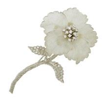 9 14K WHITE GOLD FLORAL BROOCH formed with a carved rock crystal flower head and decorated with 19 full cut diamonds