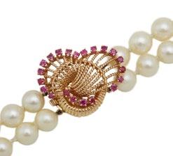 12 BIRKS DOUBLE STRAND CULTURED PEARL NECKLACE (8.0mm) completed with a 14k yellow gold clasp set with 21 small full cut rubies length 23 58.4 cm. 13 18K YELLOW GOLD RING set with a pearl (13.5mm.
