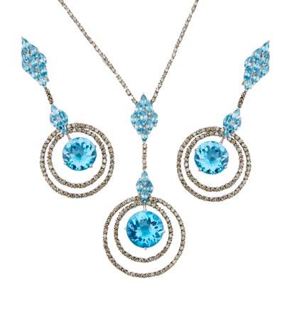 16 18K WHITE GOLD NECKLACE AND EARRINGS set with various cut blue topaz and decorated with a total of 325 brilliant