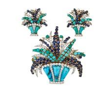 2 grams $3,000 4,000 17 18K YELLOW GOLD AND PLATINUM FLORAL SPRAY BROOCH AND CLIP-BACK EARRINGS set with a total of